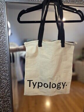 Typology Paris Cream Lightweight Canvas Jute Tote with Black Straps And Logo
